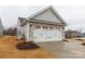 Spacious two-car garage with attractive stone and siding exterior at 143 Commerce Blvd, Lancaster, SC 29720