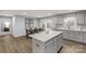 Bright kitchen featuring an island, stainless steel appliances, and an open layout connecting to the dining area at 143 Commerce Blvd, Lancaster, SC 29720