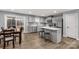 Modern kitchen features stainless steel appliances, a spacious island with seating, and plenty of natural light at 143 Commerce Blvd, Lancaster, SC 29720