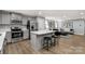 A modern kitchen flows seamlessly into the living room, offering an ideal space for both cooking and relaxation at 143 Commerce Blvd, Lancaster, SC 29720