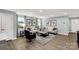 Bright living room featuring modern decor, comfortable seating, and hardwood floors at 143 Commerce Blvd, Lancaster, SC 29720
