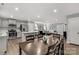 Open-concept living space with a modern kitchen, dining area, and living room, perfect for entertaining and Gathering gatherings at 143 Commerce Blvd, Lancaster, SC 29720