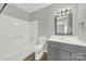 Modern bathroom features a shower and tub, single vanity, and updated mirror at 1642 Eagles Pl # H-103, Rock Hill, SC 29732