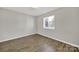 Cozy bedroom boasts natural light and neutral tones with modern flooring at 1642 Eagles Pl # H-103, Rock Hill, SC 29732