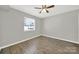 Relaxing bedroom featuring a ceiling fan and plenty of natural light at 1642 Eagles Pl # H-103, Rock Hill, SC 29732