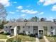An inviting exterior shot of apartments with traditional styling and green space at 1642 Eagles Pl # H-103, Rock Hill, SC 29732