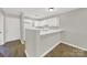 Bright kitchen featuring white cabinetry, modern flooring, and open layout at 1642 Eagles Pl # H-103, Rock Hill, SC 29732
