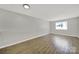 Bright living room with laminate floors and a large window providing natural light at 1642 Eagles Pl # H-103, Rock Hill, SC 29732