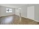 Cozy living room with wood floors and an open doorway to another room at 1642 Eagles Pl # H-103, Rock Hill, SC 29732