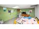 Basement bedroom featuring a comfortable bed and colorful wall art at 17154 Frog Pond Rd, Oakboro, NC 28129