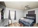 Comfortable bedroom with wood floors, ceiling fan, and a serene ambiance at 17154 Frog Pond Rd, Oakboro, NC 28129
