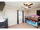 Cozy bedroom featuring a bunk bed and a window with natural light at 17154 Frog Pond Rd, Oakboro, NC 28129