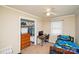 Comfortable bedroom with a twin bed, dresser, closet, and a desk for studying or gaming at 17154 Frog Pond Rd, Oakboro, NC 28129