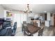 Inviting dining room with a wooden table and a view of the kitchen at 17154 Frog Pond Rd, Oakboro, NC 28129