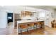 Modern kitchen island with seating, open shelving and stainless steel appliances at 176 Chestnut Ln, Gastonia, NC 28052