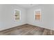 Bright bedroom featuring modern flooring and windows that provide natural light at 1826 Taylor Ave, Charlotte, NC 28216