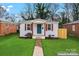 Charming home with fresh green lawn and attractive curb appeal at 1826 Taylor Ave, Charlotte, NC 28216