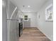 Well-lit kitchen with stainless steel refrigerator, updated cabinetry, and modern countertops at 1826 Taylor Ave, Charlotte, NC 28216