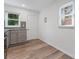 Modern kitchen featuring stylish gray cabinetry, granite countertops, and a sunny window at 1826 Taylor Ave, Charlotte, NC 28216