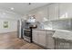 Modern kitchen with granite counters, stainless steel appliances, and gray subway tile backsplash at 1826 Taylor Ave, Charlotte, NC 28216