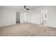 Spacious bedroom with new carpet, ceiling fan, and an adjoining closet at 1841 Ellick Dr, Newton, NC 28658