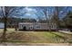 Charming single-story home features a well-maintained yard and inviting entryway at 1841 Ellick Dr, Newton, NC 28658