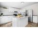 Bright kitchen featuring white cabinetry, granite countertops, stainless steel appliances, and a kitchen island at 1841 Ellick Dr, Newton, NC 28658