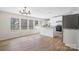 Bright kitchen featuring white cabinetry, granite countertops, stainless steel appliances, and a kitchen island at 1841 Ellick Dr, Newton, NC 28658
