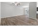 Bright and airy living room with a ceiling fan and French doors, offering ample natural light at 2021 Mcdonald Dr, Charlotte, NC 28216