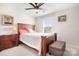 Bedroom with dark wood furniture, ceiling fan and natural light at 2024 Linn Cv, Waxhaw, NC 28173