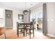 Cozy dining area with a round table, modern lighting, and access to outdoor patio and grill at 2024 Linn Cv, Waxhaw, NC 28173