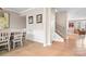 Elegant dining room with hardwood floors adjacent to an entryway and living space at 2024 Linn Cv, Waxhaw, NC 28173