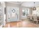 Bright entryway with a decorative leaded glass door and sidelights, opening to the dining area at 2024 Linn Cv, Waxhaw, NC 28173