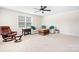 Living room featuring a plush sofa, leather recliner, and neutral carpet at 2024 Linn Cv, Waxhaw, NC 28173