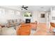 Inviting living room with fireplace, comfortable seating, ceiling fan, and stylish decor at 2024 Linn Cv, Waxhaw, NC 28173