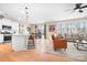 Inviting living space featuring a modern kitchen, a cozy sitting area, and stylish hardwood floors at 2024 Linn Cv, Waxhaw, NC 28173