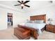 Spacious main bedroom with tray ceiling, and a view to the walk-in closet at 2024 Linn Cv, Waxhaw, NC 28173