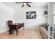 Office featuring a wooden desk, tan sofa, and a ceiling fan for optimal comfort at 2024 Linn Cv, Waxhaw, NC 28173