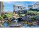 Picturesque water feature with a charming mill house, enhanced by lush greenery and a tranquil pond at 2024 Linn Cv, Waxhaw, NC 28173