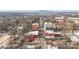 Aerial view of neighborhood street with city skyline in the distance on a sunny day at 2132 Electric Ln, Charlotte, NC 28205