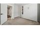 Bedroom with built-in murphy bed and shelving at 2132 Electric Ln, Charlotte, NC 28205