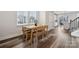 Cozy dining area with hardwood floors and a view into the modern kitchen at 2132 Electric Ln, Charlotte, NC 28205