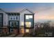 Modern townhome boasts a sleek design with balconies and inviting curb appeal at 2132 Electric Ln, Charlotte, NC 28205