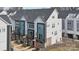 Modern townhome exterior with colorful doors, black trim, and private balconies at 2132 Electric Ln, Charlotte, NC 28205