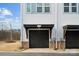 Attached garage with dark wooden door provides convenient parking and storage space at 2132 Electric Ln, Charlotte, NC 28205