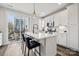Modern kitchen with stainless steel appliances, white cabinets, and a center island at 2132 Electric Ln, Charlotte, NC 28205