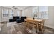 Open floor plan with hardwood floors, recessed lighting, and a modern dining table at 2132 Electric Ln, Charlotte, NC 28205