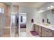 Bright bathroom featuring double vanity, tiled shower, and view to bedroom at 2598 Bryant Dr, Fort Mill, SC 29707