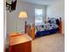 Bright bedroom featuring neutral walls, carpeted floors, a window and furnishings including a bed and side tables at 2598 Bryant Dr, Fort Mill, SC 29707