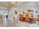 Elegant dining room with hardwood floors, chandelier, and a decorative china cabinet at 2598 Bryant Dr, Fort Mill, SC 29707